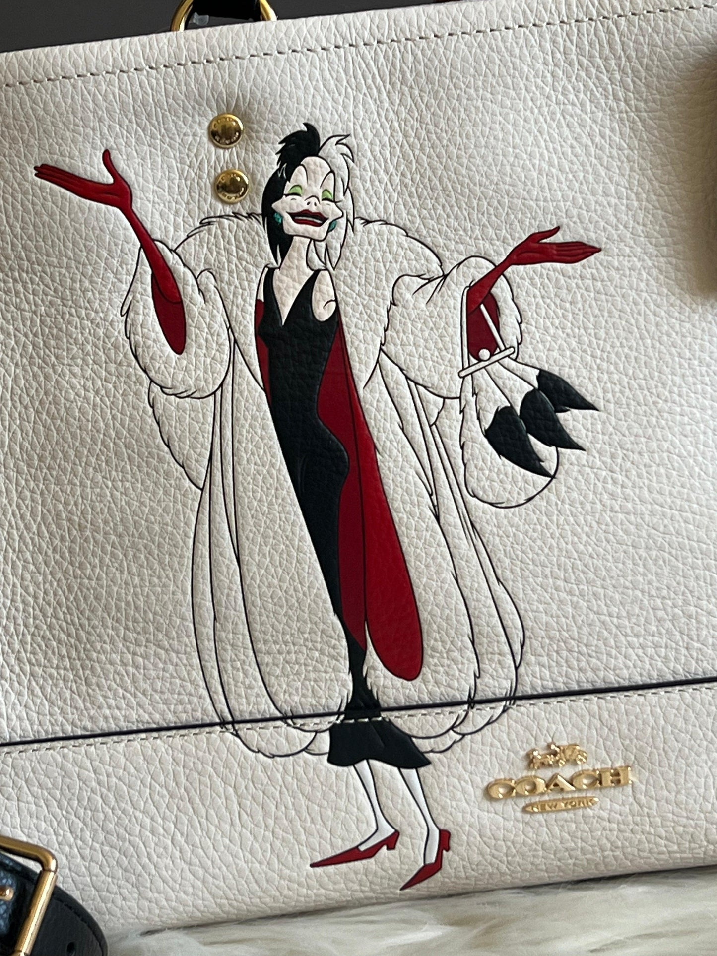Disney X Coach Dempsey Carryall with Cruella Motif