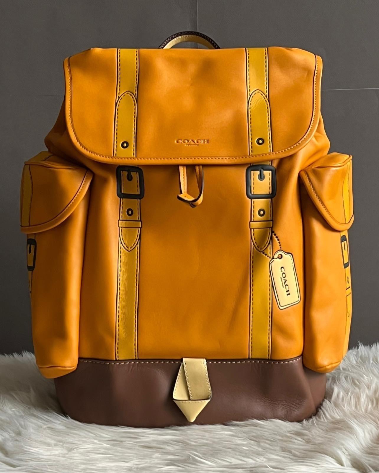 brown and orange coach backpack Coach Hitch Backpack with Trompe L'oeil – Club de Mode