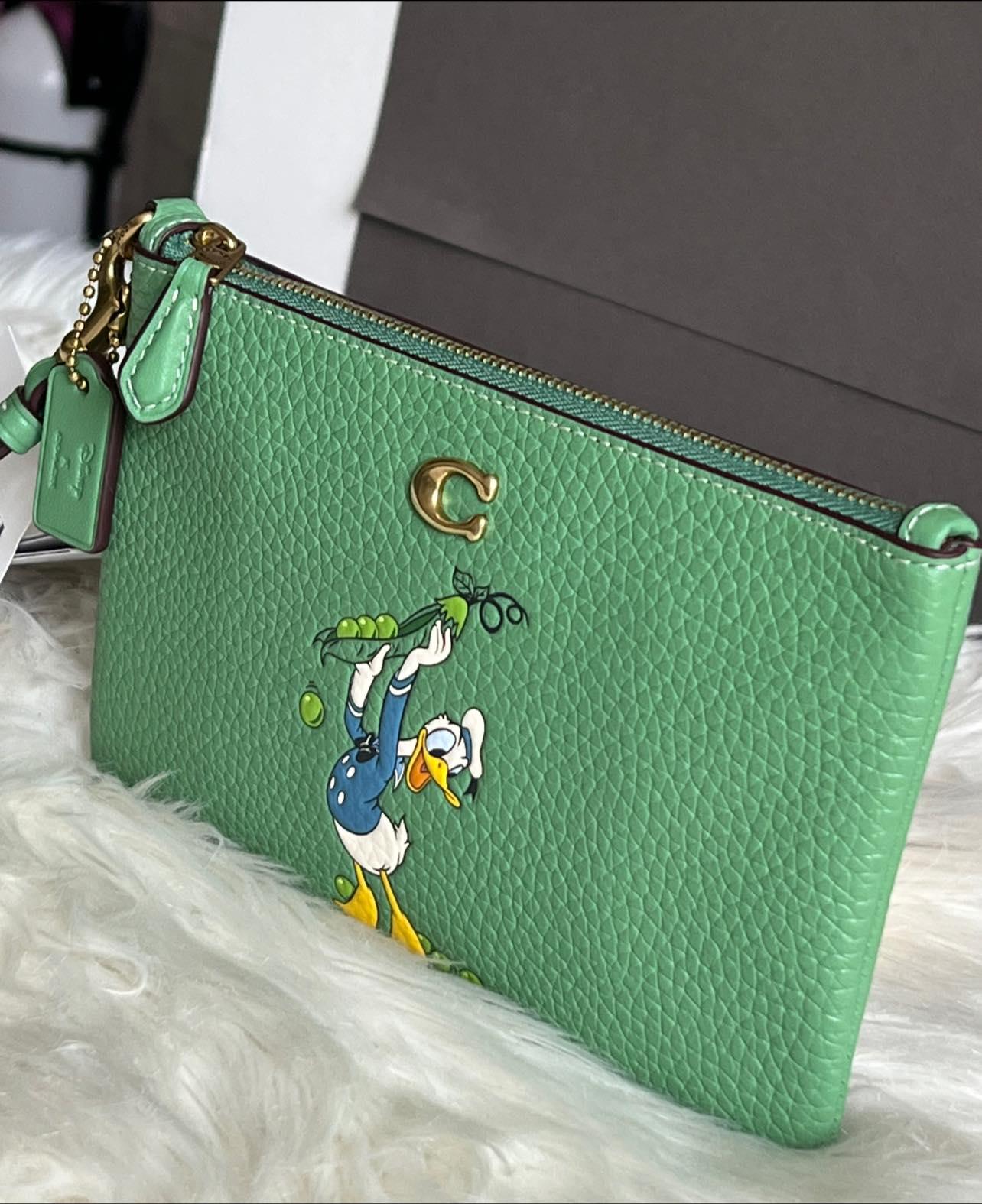 Disney X Coach Small Wristlet in Regenerative Leather with Donald Duck
