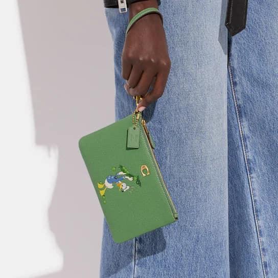 Disney X Coach Small Wristlet in Regenerative Leather with Donald Duck