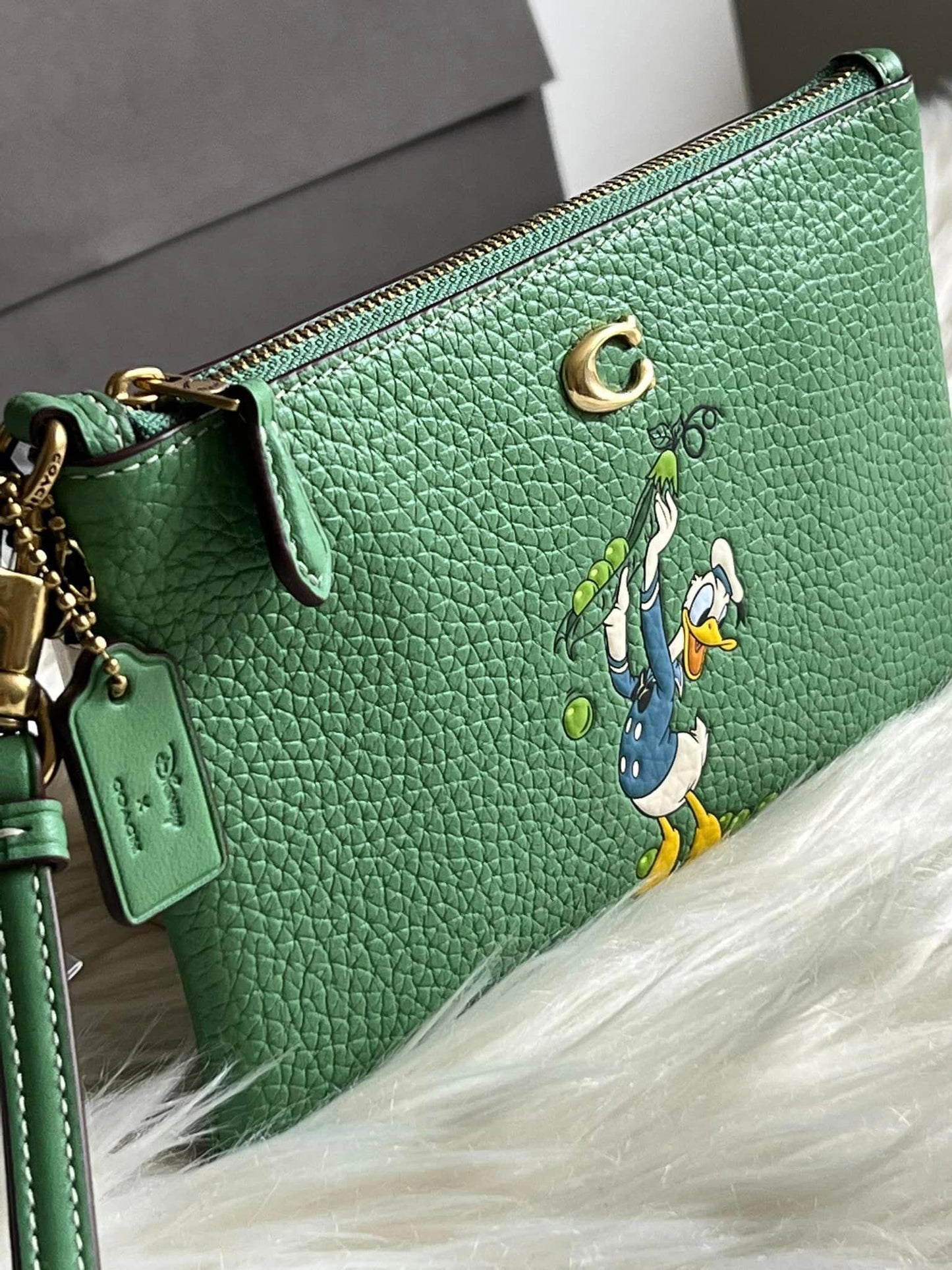 Disney X Coach Small Wristlet in Regenerative Leather with Donald Duck