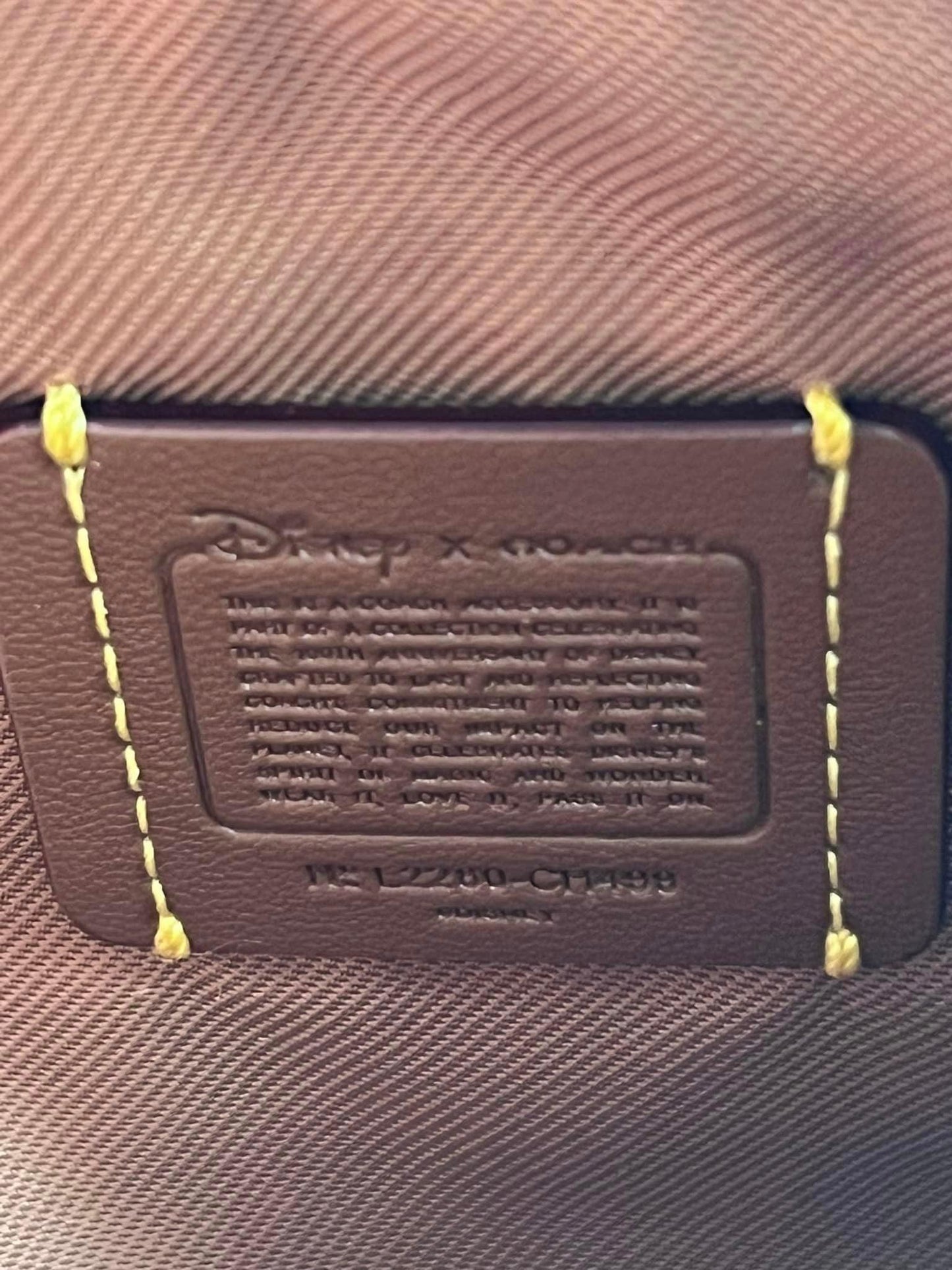Disney X Coach Small Wristlet in Regenerative Leather with Donald Duck