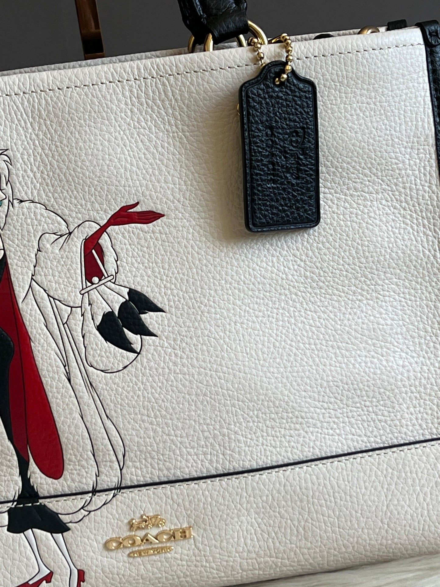 Disney X Coach Dempsey Carryall with Cruella Motif