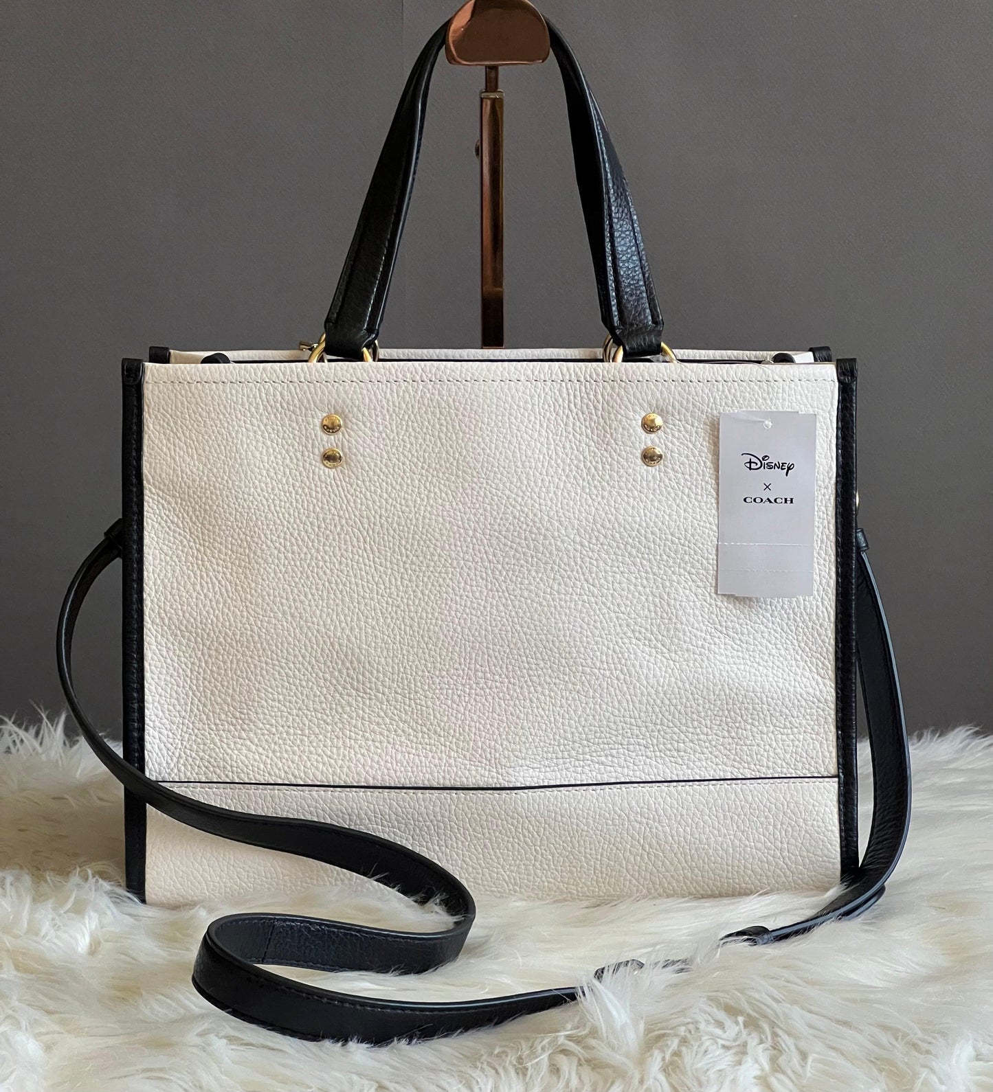 Disney X Coach Dempsey Carryall with Cruella Motif