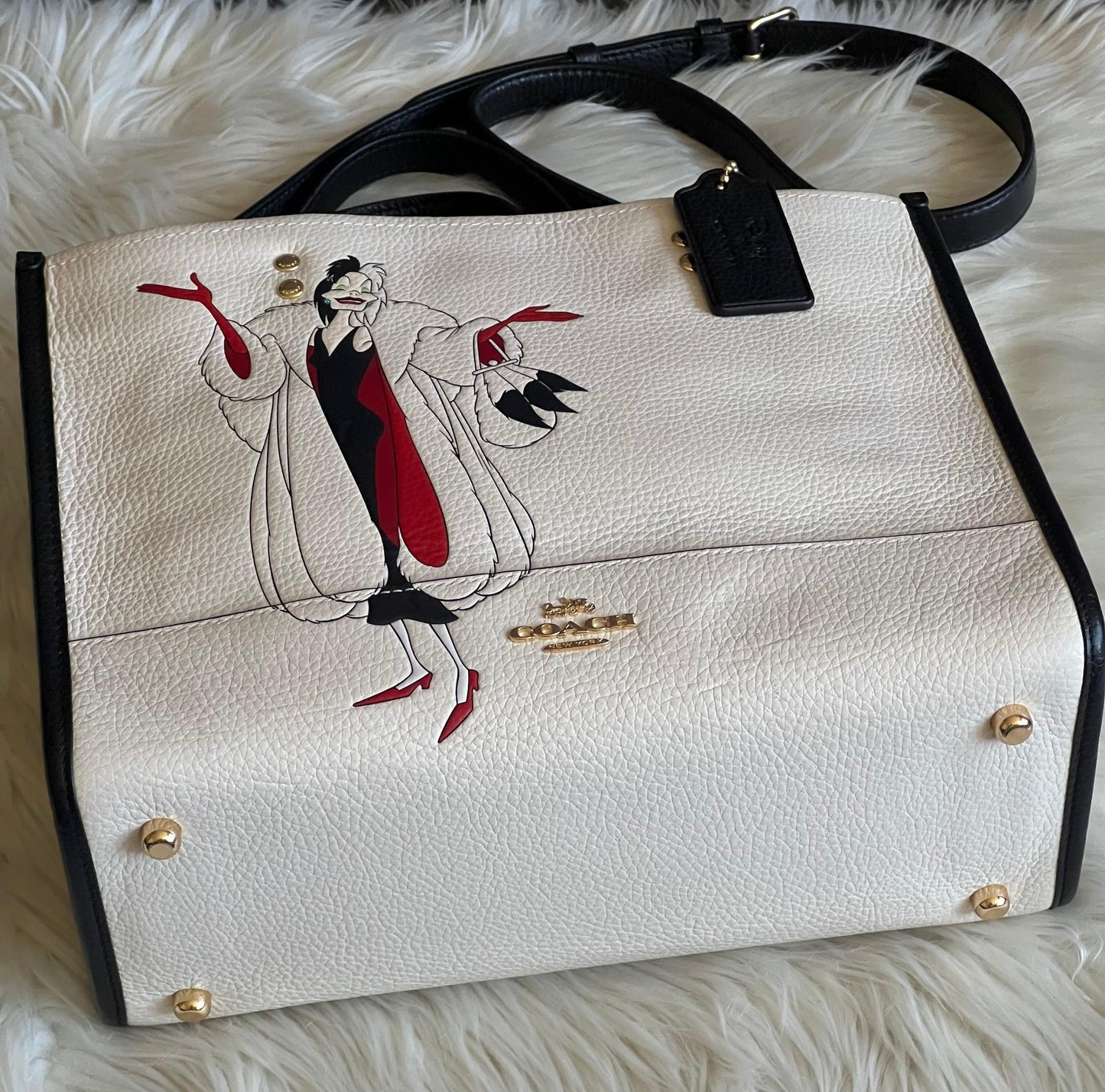Disney X Coach Dempsey Carryall with Cruella Motif
