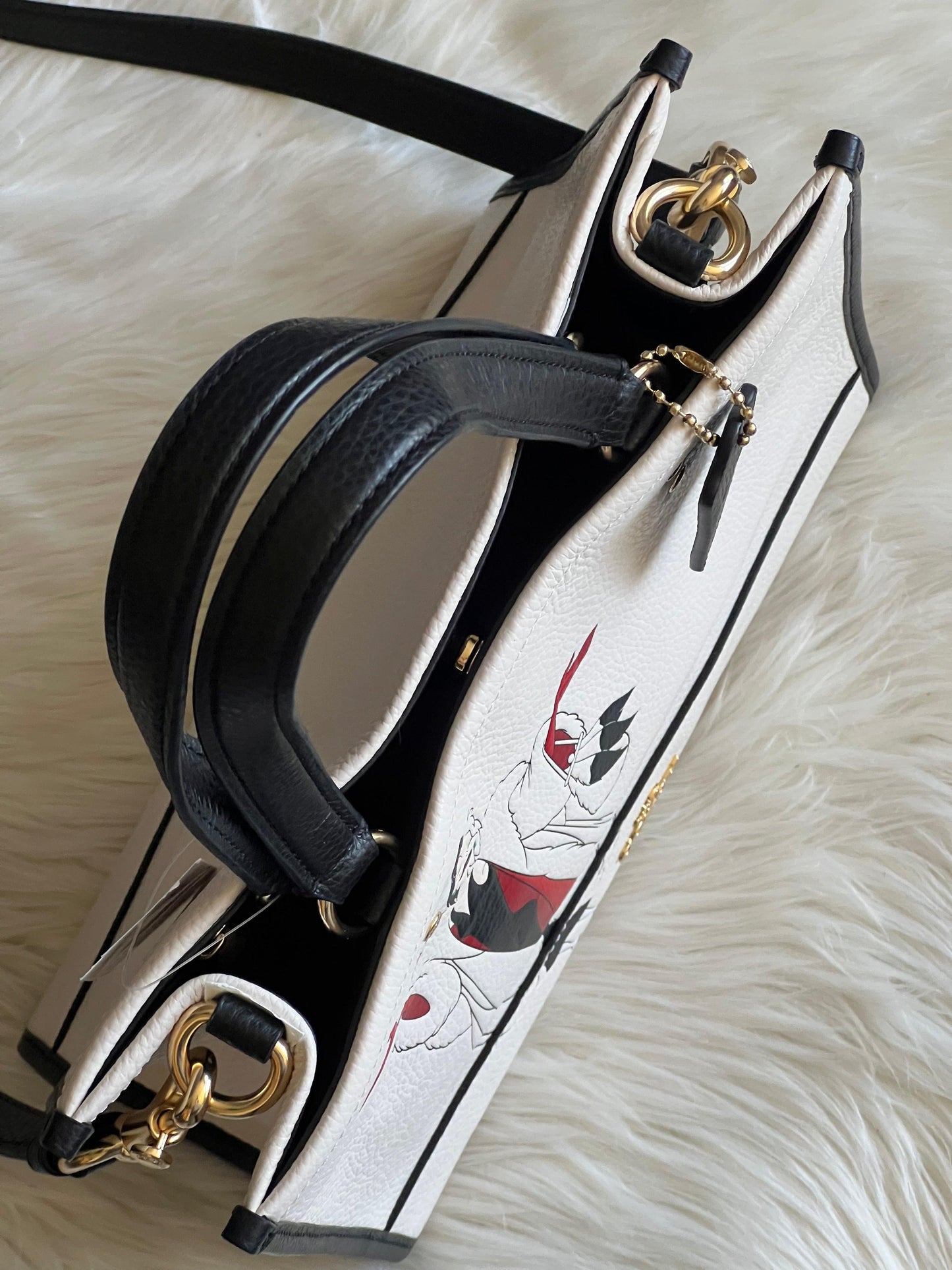 Disney X Coach Dempsey Carryall with Cruella Motif