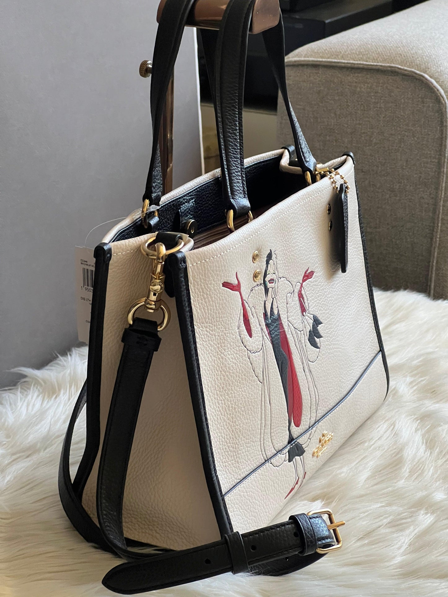 Disney X Coach Dempsey Carryall with Cruella Motif