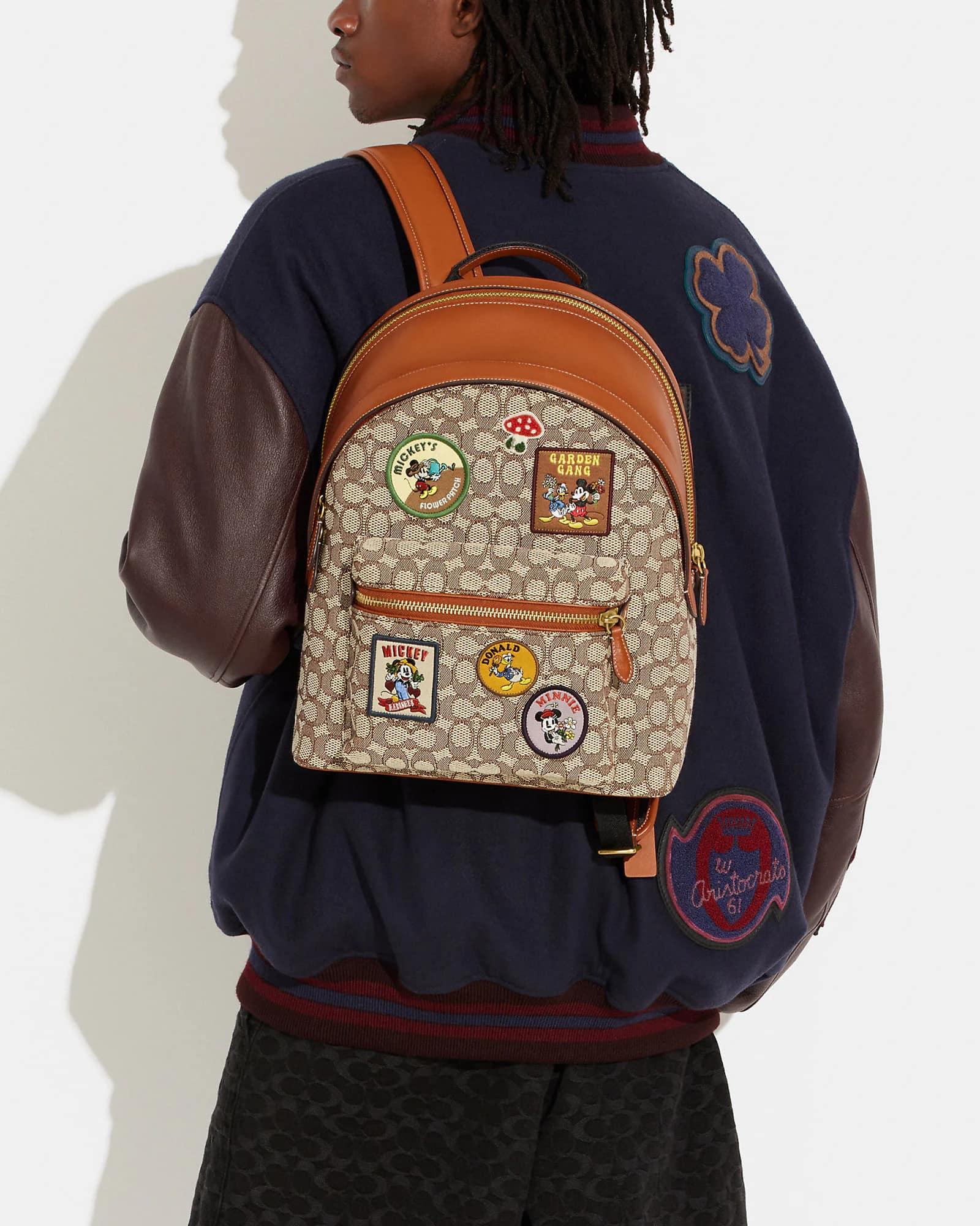 Disney X Coach Charter Backpack in Signature Textile Jacquard with Pat Club de Mode Disney X Coach Charter Backpack in Signature Textile Jacquard with Pat Club de Mode