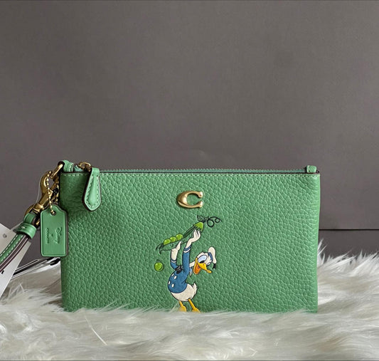 Disney X Coach Small Wristlet in Regenerative Leather with Donald Duck