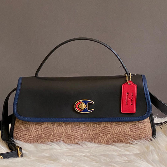 Coach X Champion Turnlock Clutch in Signature Canvas