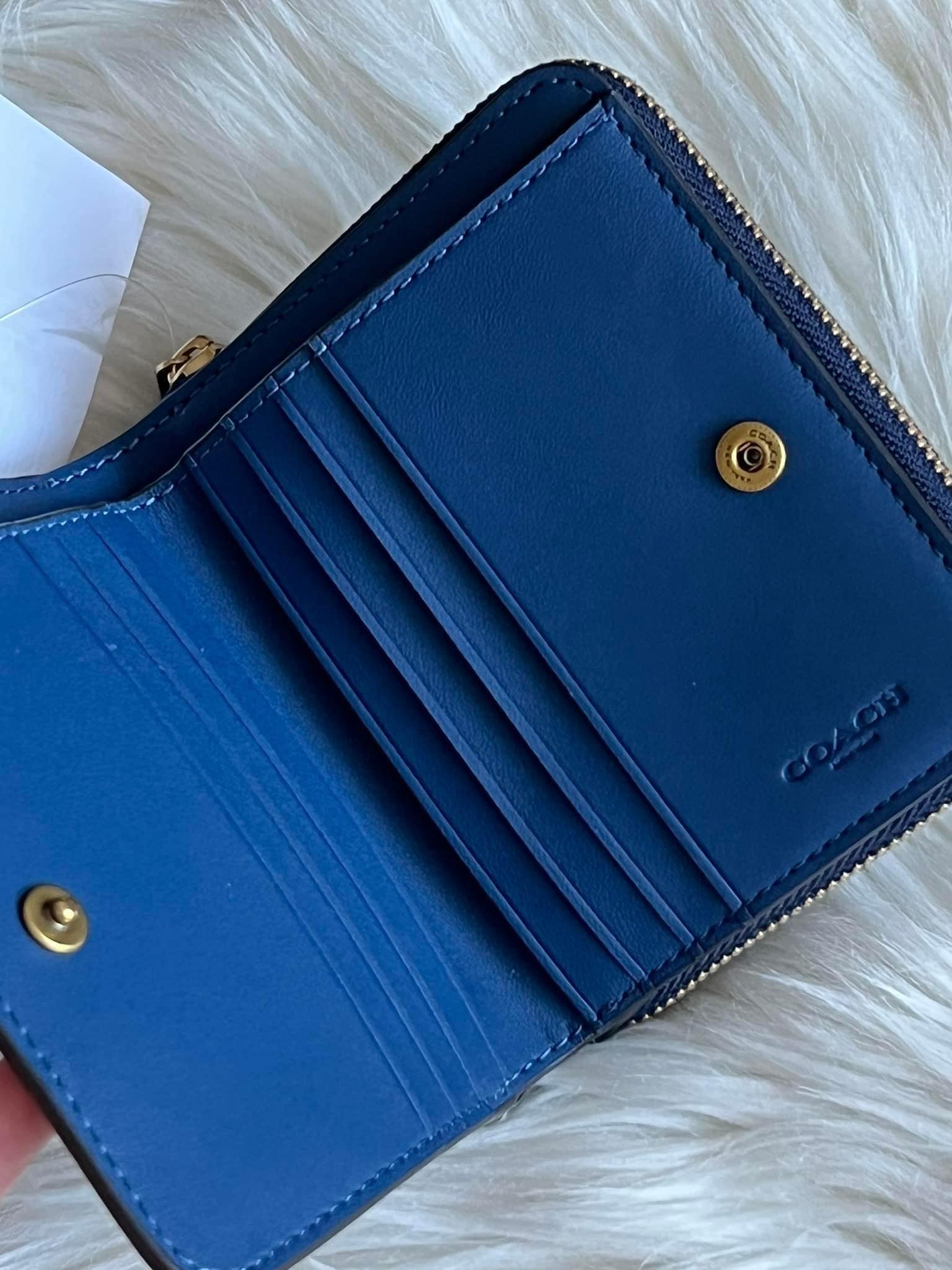 Coach wallet with online rivets