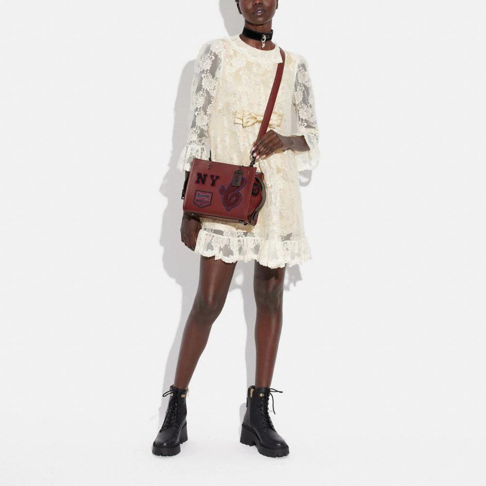 Coach Rogue 25 with Varsity Patches – Club de Mode Coach Rogue 25 with Varsity Patches – Club de Mode